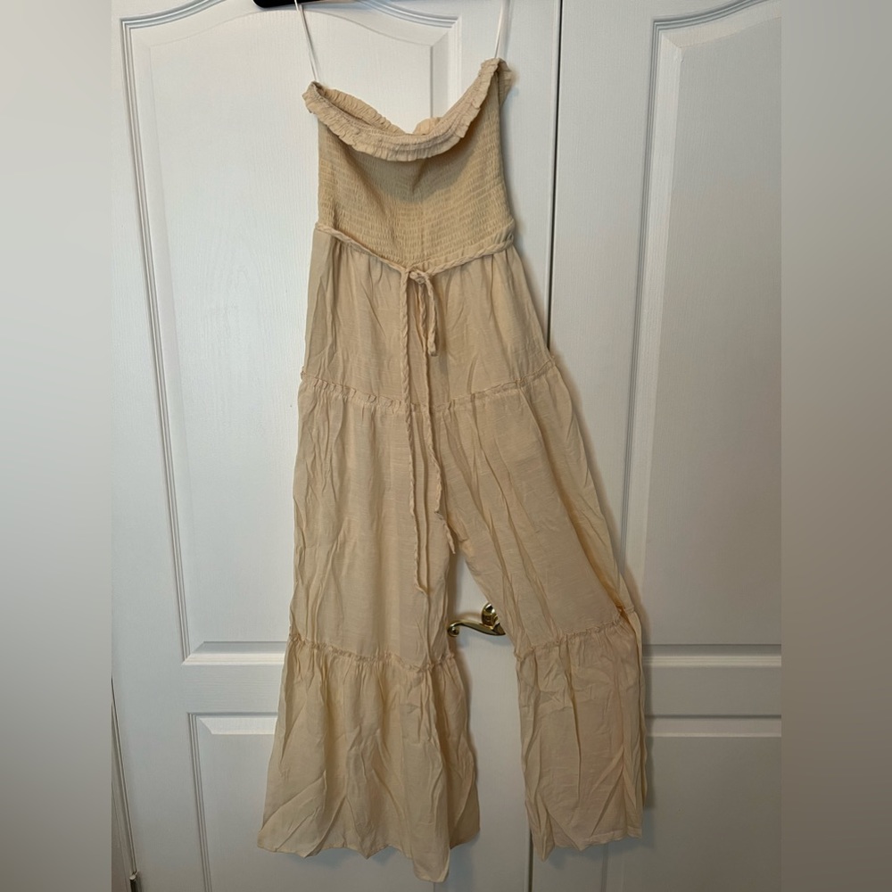Cream colored sleeveless jumpsuit